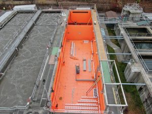 Lined water treatment tank